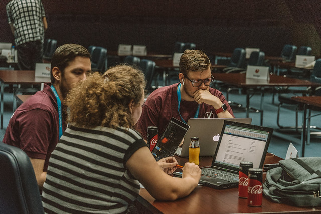 Attendees working on items for the WordPress global project in the WCEU Contributing Area